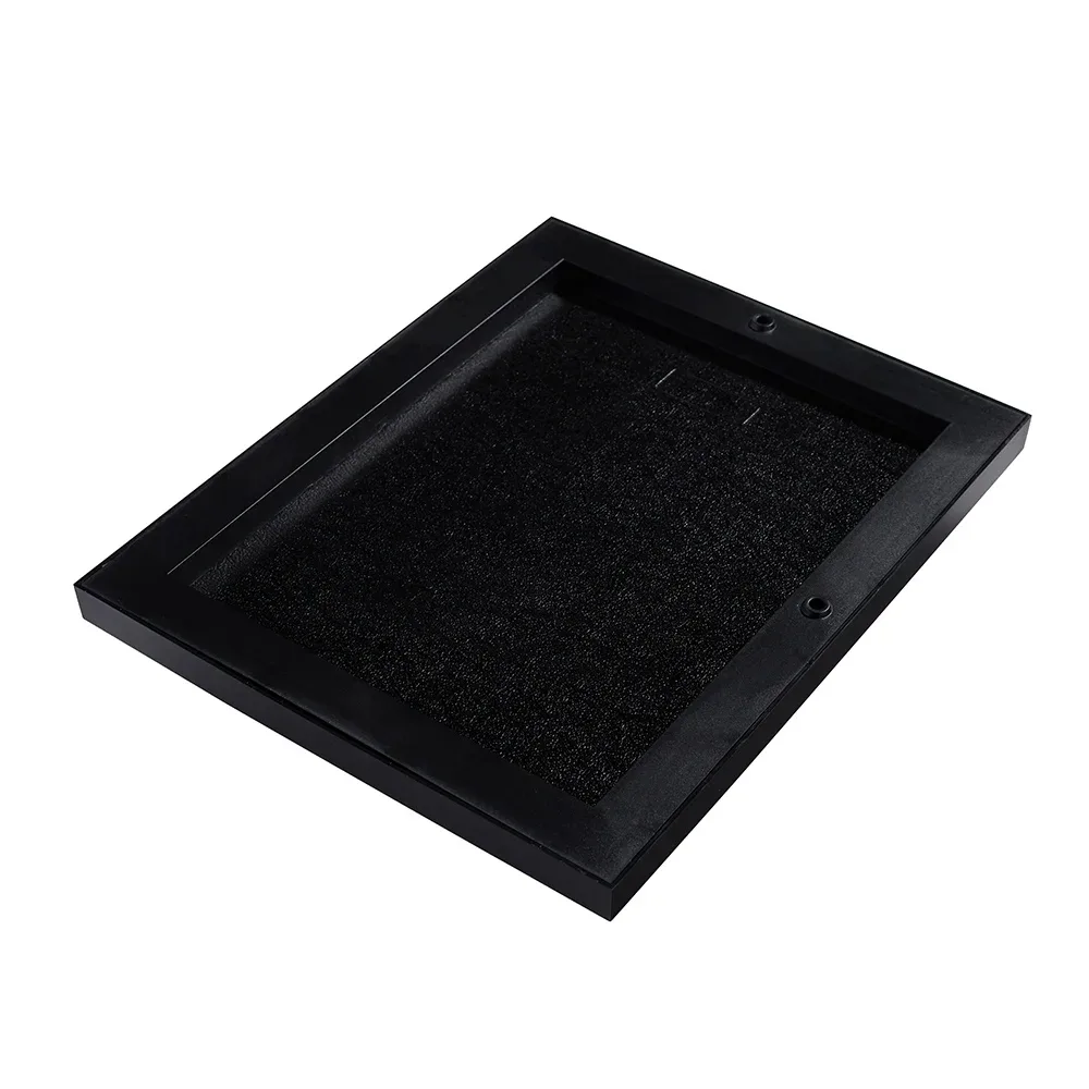 Back of a black frame with its reusable adhesive pad